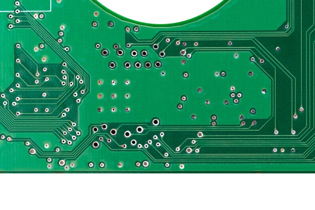 Green mechanical hard disk circuit board, local close-up on white background