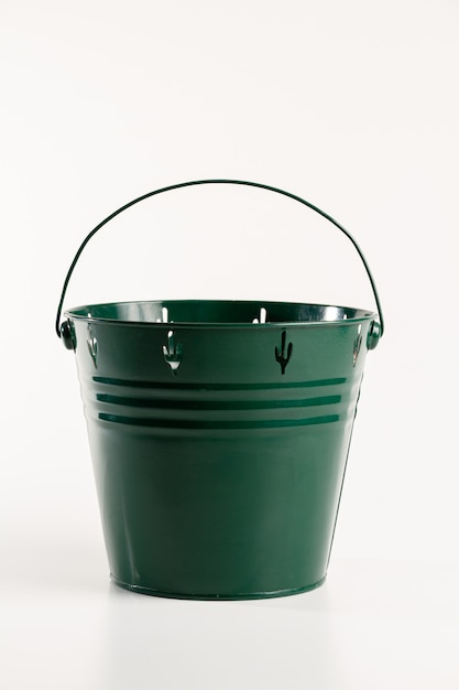 Green metal flower pot isolated on white background