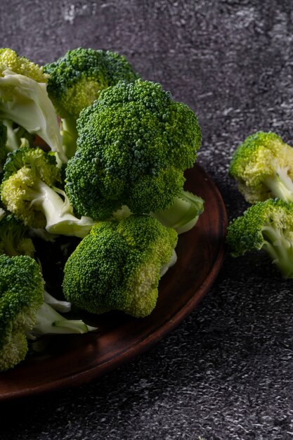 green mini broccoli on brown plate