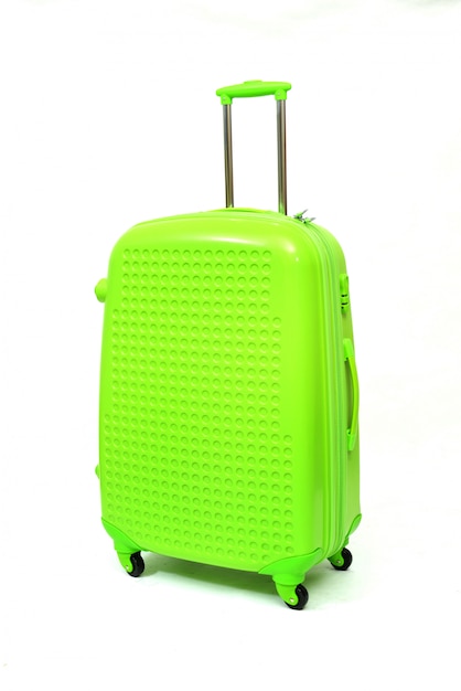 Green of modern large suitcase on a white 