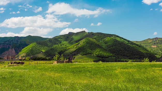 Green mountains and blue clouds landscape