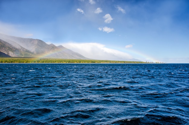 Green mountains and blue water landscape