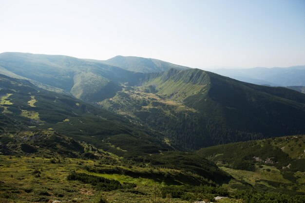 Green mountains at dawn Tourism and travel concept