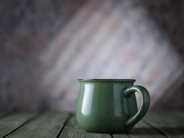 Green mug on the table