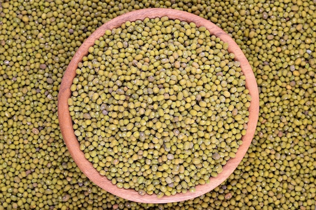 Green mung beans in a wooden bowl