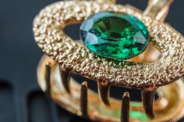 green natural gemstone Gems or gems on shiny gold