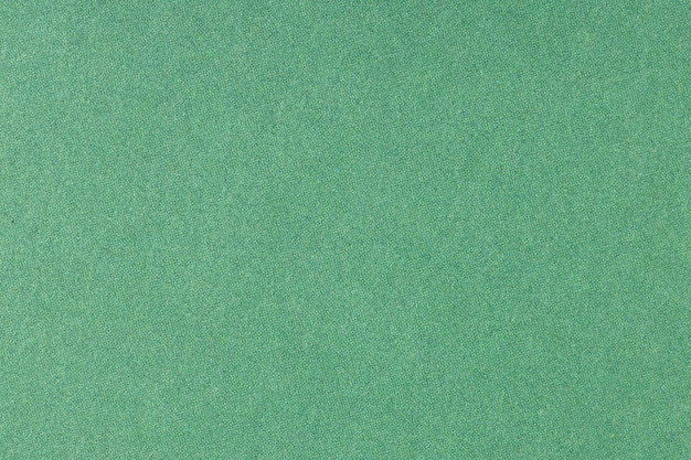 Зеленая офсетная печатная бумага фоновой текстуры. Макро крупным планом. Полный кадр