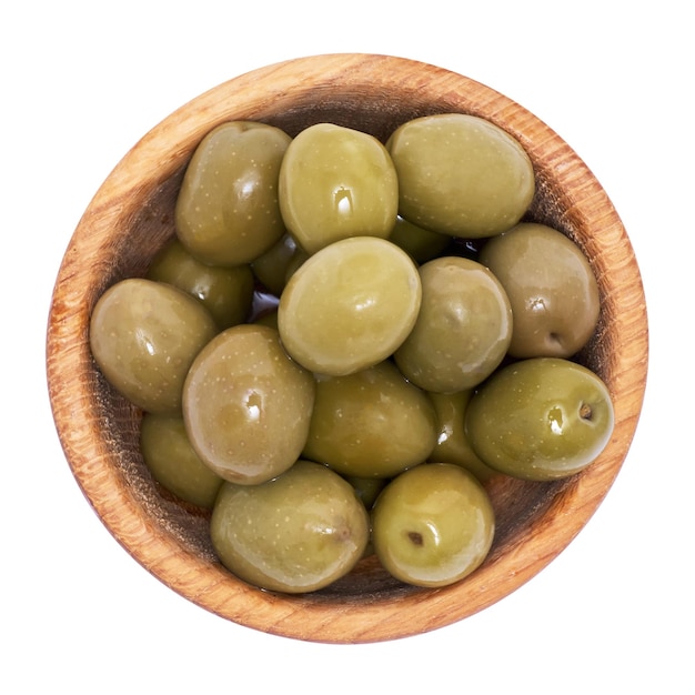 Green olives in wooden bowl isolated on white background