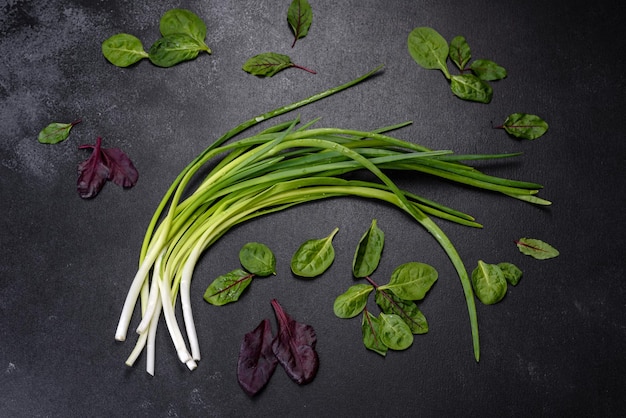 Green onion or scallion on wooden board fresh spring chives