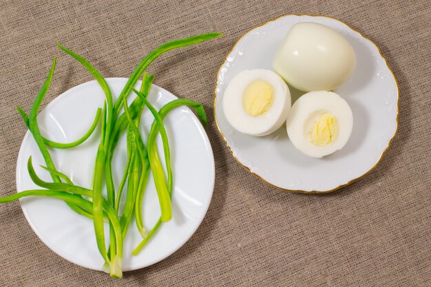 Green onions and eggs. Top view