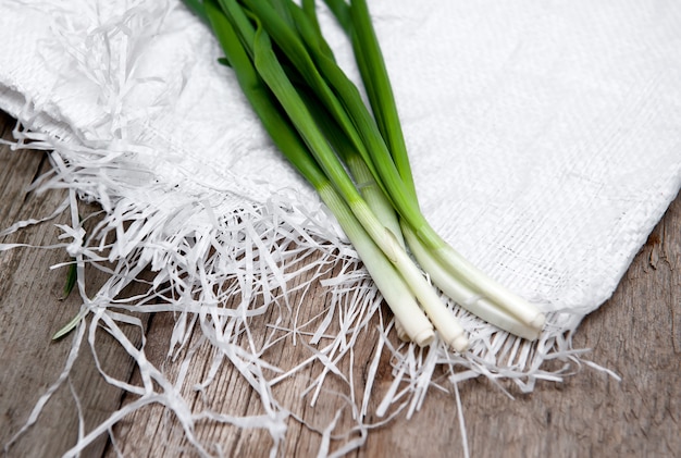 Green onions on wood