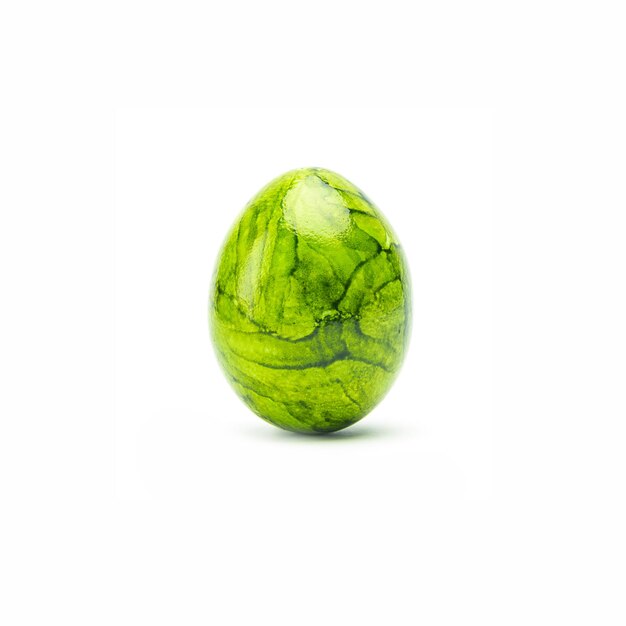 A green painted easter egg isolated on white background. Taken in Studio with a 5D mark III.