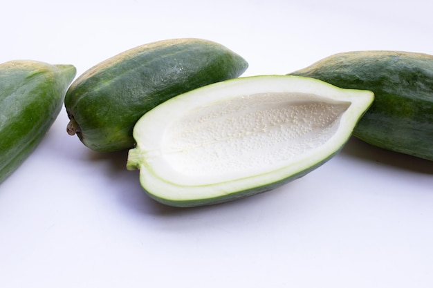 Green papaya on white background