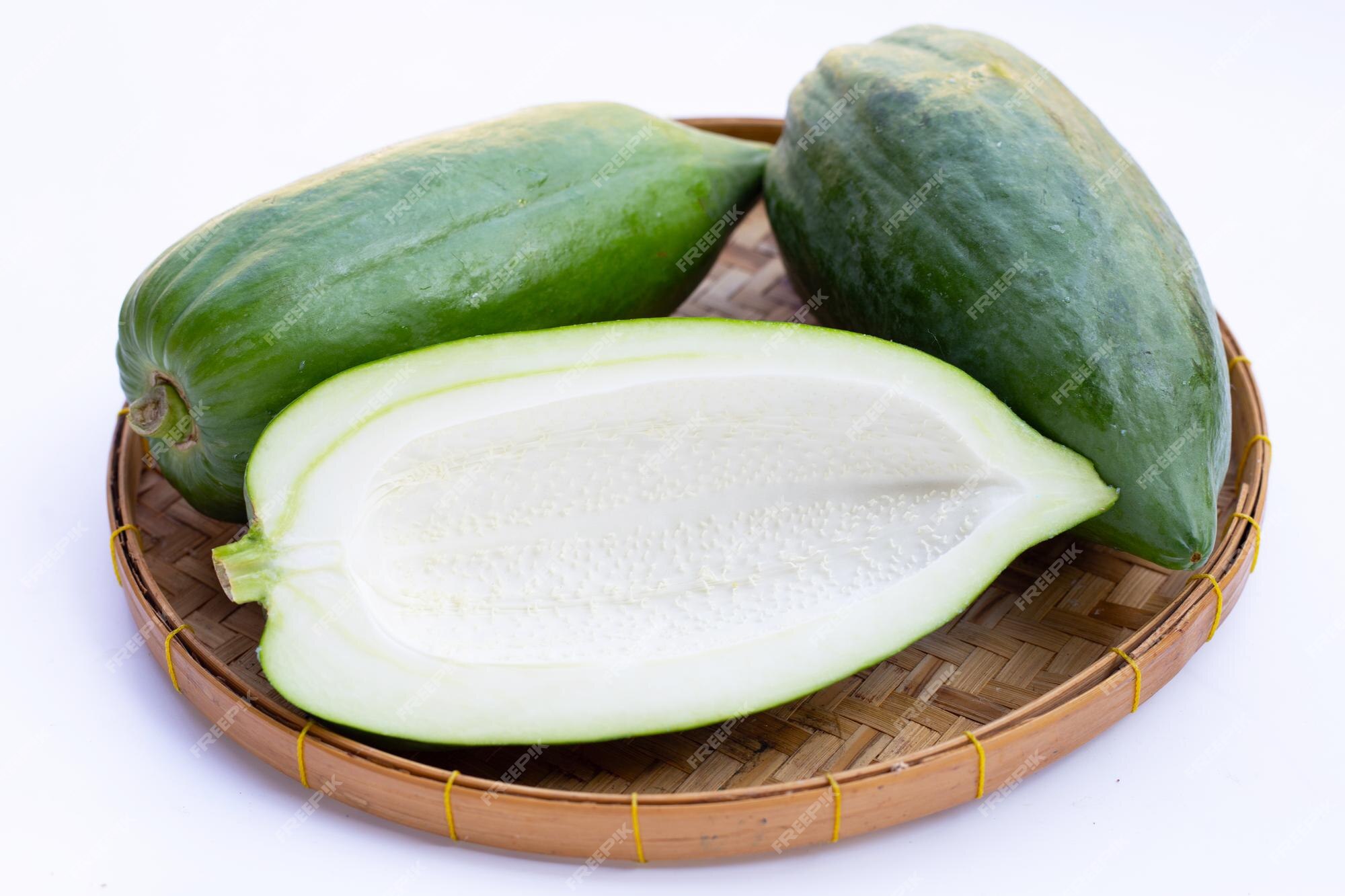 Premium Photo | Green papaya on white background