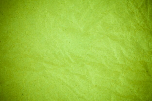 Green paper crumpled background.