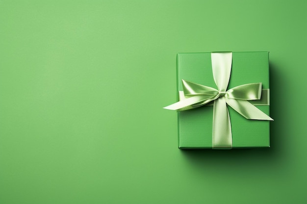 Green paper gift box on green background Green friday Sustainable consumption sustainability zero waste concept Top view Copy space for text