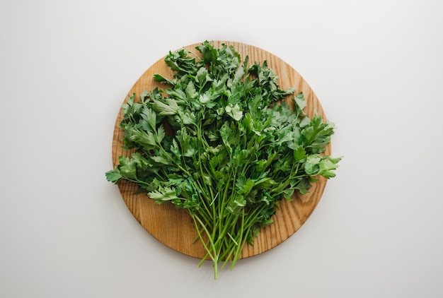 Green parsley on a wooden board