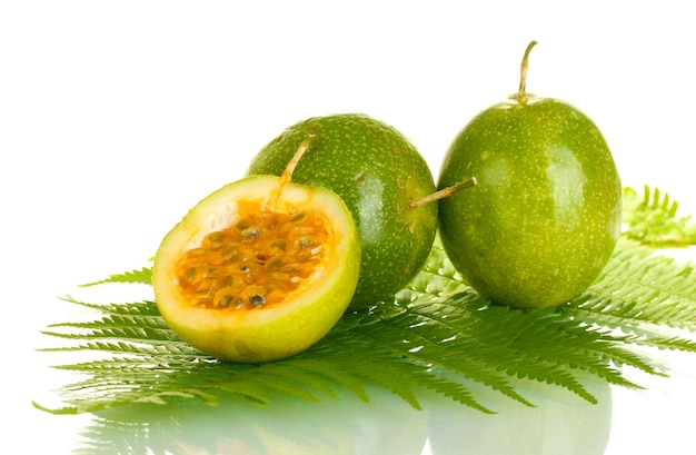 Green passion fruit on white