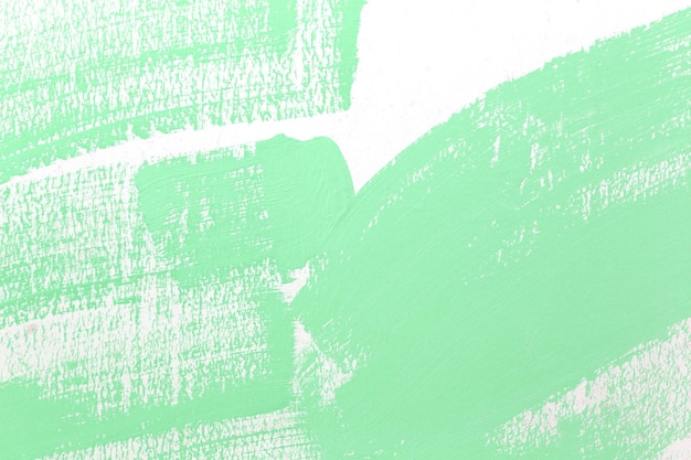 Green pattern of color paint brush on the white wall for design in your work concept