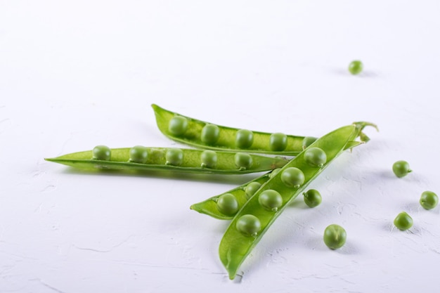 Green pea pod, green peas,  on white background