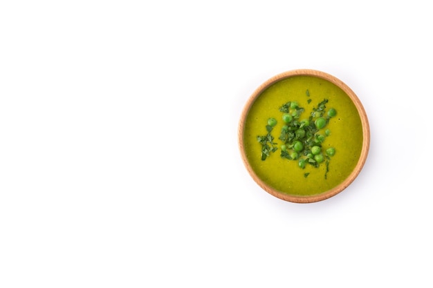 Green pea soup in a bowl isolated on white background