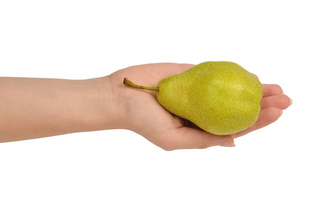 Green pear isolated on white background in woman hands.