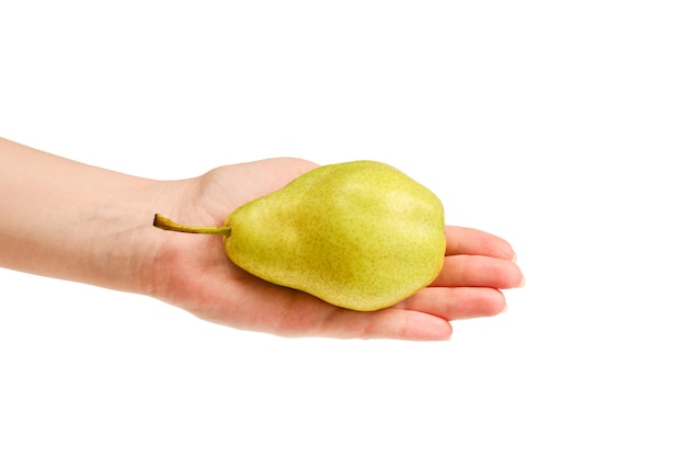 Green pear isolated on white in woman hands