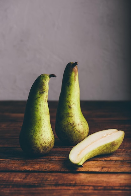 Green Pears on Wooden Table