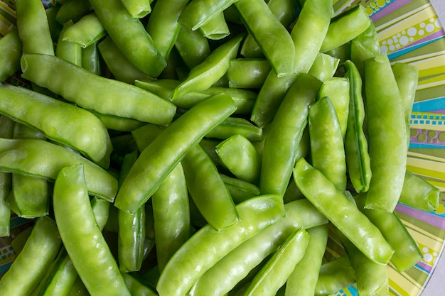 Green peas in a plate background