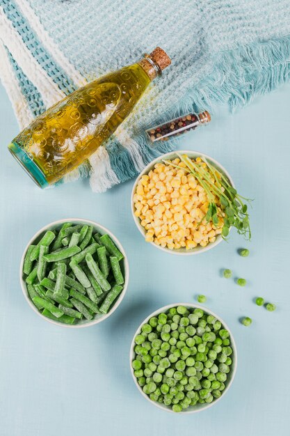 Green peas, sweet corn and cut green beans in a bowl. Concept of homemade preparations for fast cooking. Healthy vegetarian food concept