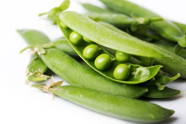 Green peas on a white background. raw diet