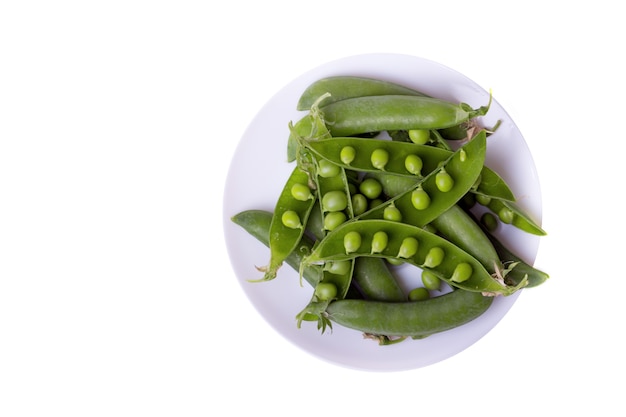Green peas on a white background. raw diet