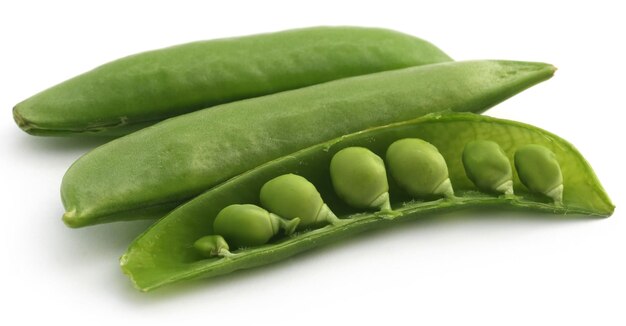 Green peas over white background