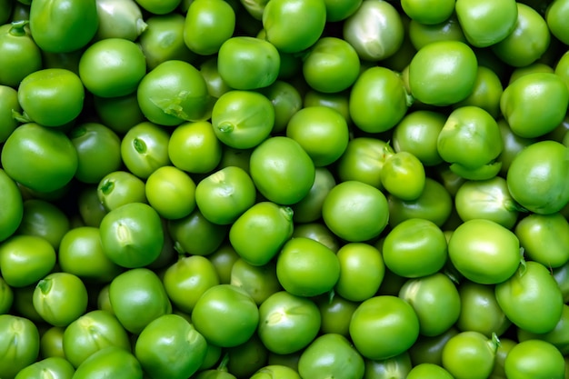 green peeled peas pile background