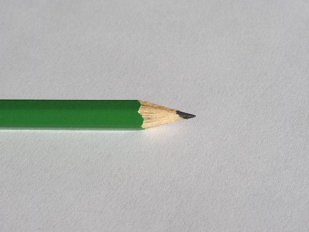 Green pencil on paper sheet