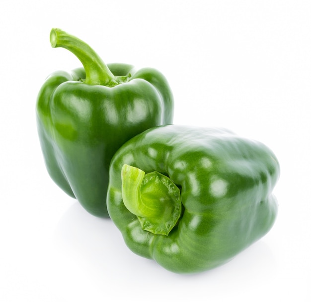 Green pepper on white wall