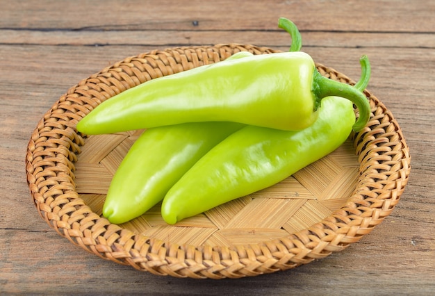 Green  pepper on wood background