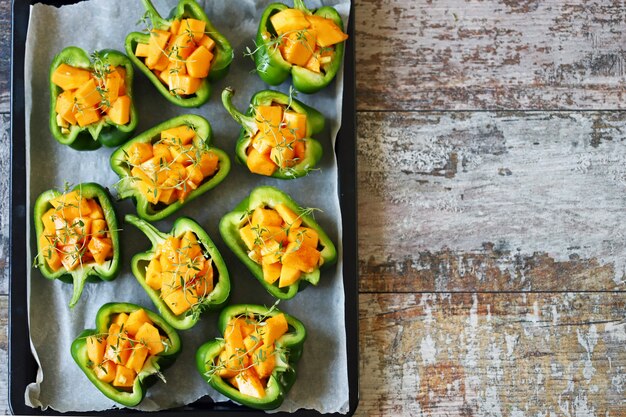 Green peppers stuffed with pumpkin. Selective focus. 