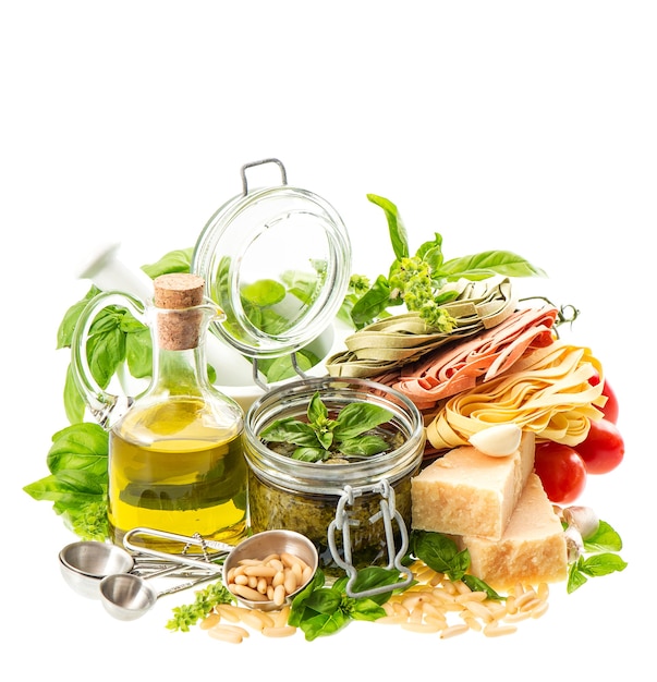 Green pesto sauce and ingredients white background Olive oil basil tomato Food background