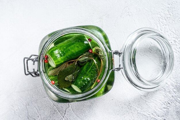 Green pickle cucumbers in a glass jar. Natural product