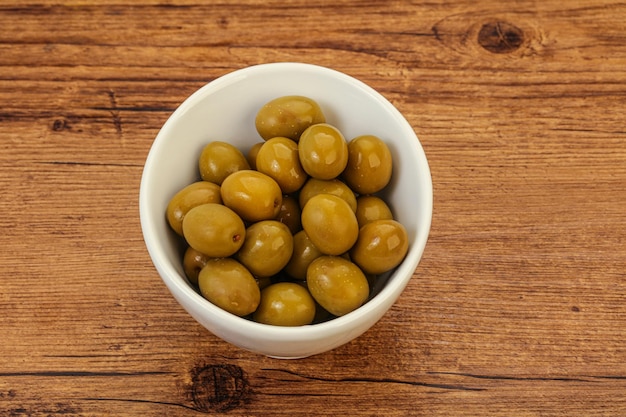 Green pickled olives in the bowl