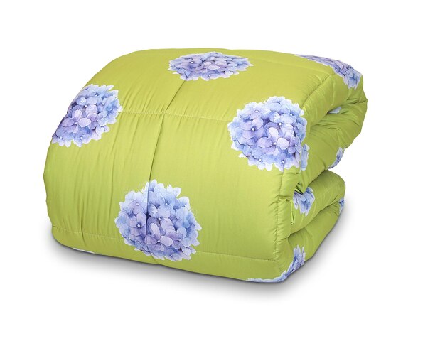 A green pillow with blue flowers on it.