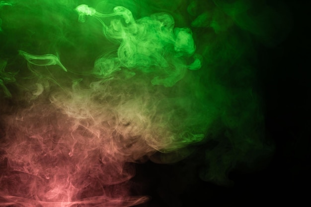 Green and pink steam on a black background