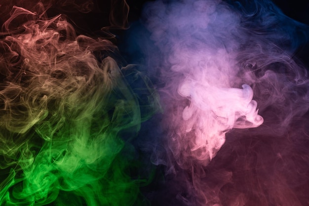 Green and pink steam on a black background