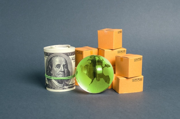 Green planet earth globe bundle of money and cardboard boxes Business and commerce