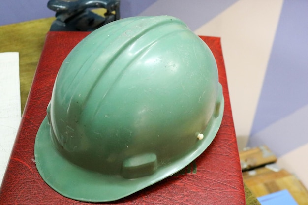 Green plastic safety helmet for the worker Protective helmet to protect the head of people operating