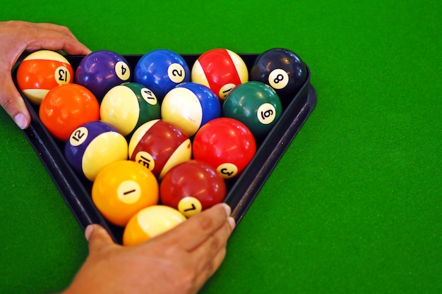 Green pool table with ball.