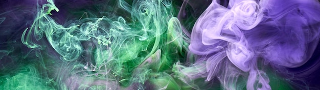 Green purple smoke abstract background acrylic paint underwater explosion