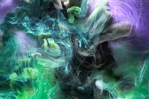 Green purple smoke abstract background acrylic paint underwater explosion