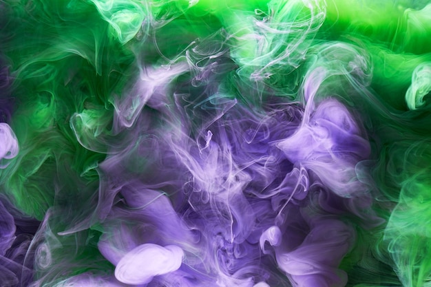 Green purple smoke abstract background acrylic paint underwater explosion